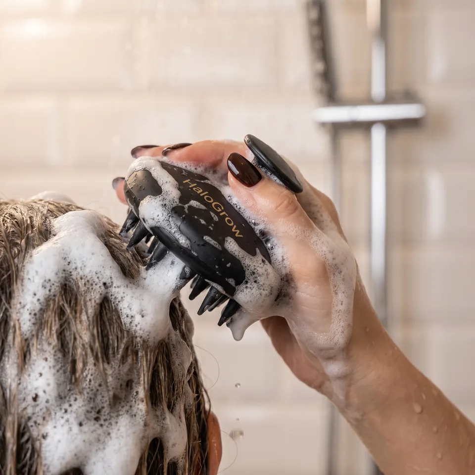 HaloGrow Scalp Massager in use